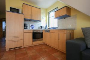 Η κουζίνα ή μικρή κουζίνα στο Utkiek W5 - Ihr Hafen der Erholung in Zingst +9 φωτογραφίες