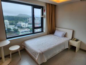 Postel nebo postele na pokoji v ubytování Rezion Hotel + 37 fotografií