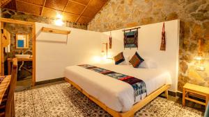 Postel nebo postele na pokoji v ubytování Supan Ecolodge