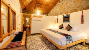 Postel nebo postele na pokoji v ubytování Supan Ecolodge