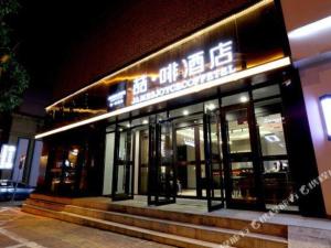 a store front of a building at night at James Joyce Coffetel Changchun People's Square in Changchun