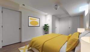 a bedroom with a bed with a yellow blanket at Scotchmere Serenity: Modern 1-Bedroom Brampton Haven in Brampton