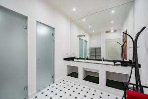 a bathroom with a sink and a mirror at Celine Residence Luxury in Budapest