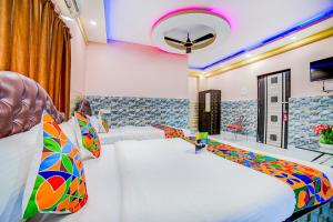 Letto o letti in una camera di FabExpress Nest - Nr Park Street Metro Station