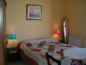 A bed or beds in a room at B&b La Giara