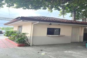 a small house with a flat screen tv on it at OYO 1026 Evita Hotel Bacoor in Cavite