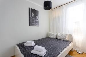 Katil atau katil-katil dalam bilik di Golden Apartments in Warsaw - Browary Warszawskie - Żelazna