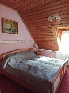 Posteľ alebo postele v izbe v ubytovaní Ginkgo Apartman
