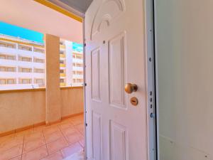 a door in a room with a view of a building at Mar de Cristal Resort Apartamentos - Parking in Mar de Cristal