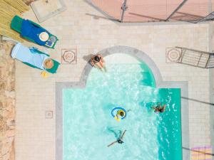 a water park with people swimming in a pool at Angel Village in San Teodoro