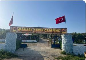 a sign for a masanian golf tournament campaigning at Makara camp in Şarköy