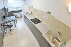 Kuchyň nebo kuchyňský kout v ubytování Twój Hostel Bytom