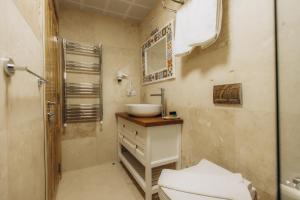 a bathroom with a sink and a toilet at Cappadocia Villa Comfort in Nevsehir