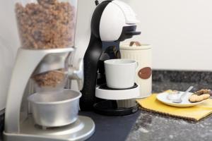a coffee maker sitting on a counter with some food at El Motín in Zamora +21 photos
