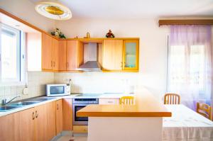 A kitchen or kitchenette at Villa Fotini with ocean view