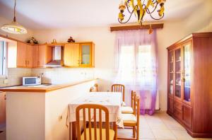 A kitchen or kitchenette at Villa Fotini with ocean view