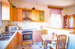 A kitchen or kitchenette at Villa Fotini with ocean view