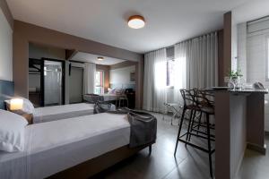 Postel nebo postele na pokoji v ubytování Lym Flat Hotel