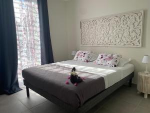 Letto o letti in una camera di CARIBBEAN RESIDENCE