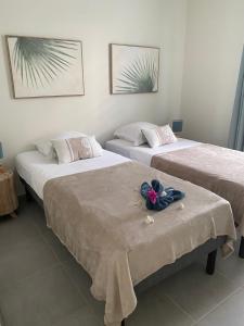 Letto o letti in una camera di CARIBBEAN RESIDENCE