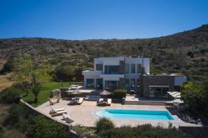 an aerial view of a villa with a swimming pool at Elounda White Pearl Villa in Agios Nikolaos