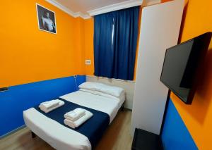 Katil atau katil-katil dalam bilik di Hotel Positano