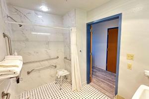 a bathroom with a shower and a sink at Microtel Inn & Suites by Wyndham Gallup - PET FRIENDLY in Gallup