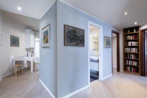 a room with a hallway with a bedroom and a table at Appartamento con vista sul mare!!! 008055-LT-0380 in Sanremo