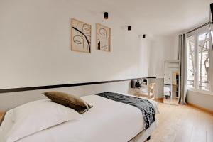 Ένα ή περισσότερα κρεβάτια σε δωμάτιο στο Maison Urbaine