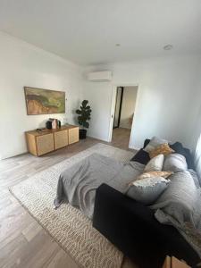 a living room with a couch and a table at Glass Street Retreat in Kalbarri