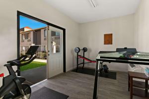 a home gym with a treadmill and a desk at Quality Inn in Lavonia