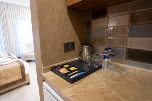 a kitchen counter with a tray with drinks on it at Orange Sisli in Istanbul