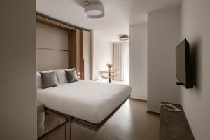 TV a/nebo společenská místnost v ubytování The Sliema Suites