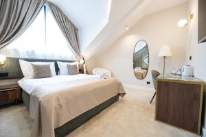 Ένα ή περισσότερα κρεβάτια σε δωμάτιο στο Boem Exclusive Rooms Skadarlija