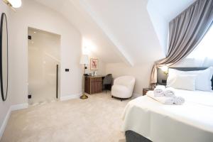 Ένα ή περισσότερα κρεβάτια σε δωμάτιο στο Boem Exclusive Rooms Skadarlija