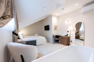 Ένα ή περισσότερα κρεβάτια σε δωμάτιο στο Boem Exclusive Rooms Skadarlija