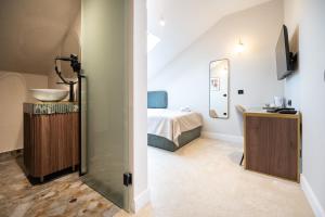 Ένα ή περισσότερα κρεβάτια σε δωμάτιο στο Boem Exclusive Rooms Skadarlija