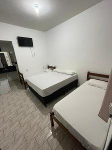 Hotel E Flats LISBOA tesisinde bir odada yatak veya yataklar