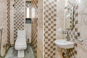 a bathroom with a toilet and a sink at FabExpress Scholer Motel in Kolkata