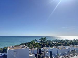 a view of the ocean from a building at Duplex vistas mar con piscina in Sant Pere de Ribes