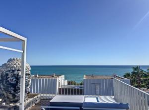 a view of the ocean from the balcony of a house at Duplex vistas mar con piscina in Sant Pere de Ribes +30 photos