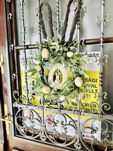 a door with a basket with easter eggs and a wreath at Danube Panorama apartments in Budapest