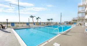 a large blue swimming pool next to a beach at 427 E Miami Ave, Unit 509 in Wildwood Crest