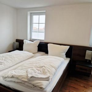 Ein Bett oder Betten in einem Zimmer der Unterkunft DM Hotels & Apartments - Apartment Pfarrgasse 09
