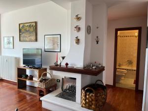A television and/or entertainment centre at Stella delle Rocche House