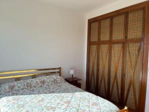 Postel nebo postele na pokoji v ubytování Stella delle Rocche House