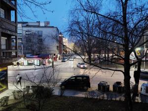 a city street with a car parked on the street at Home apartment in Niš