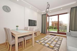 Televízia a/alebo spoločenská miestnosť v ubytovaní City Center - Riverside by Apartmore