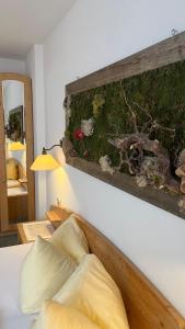 a bedroom with a bed with a wooden headboard at Ferienhaus Ahorn in Neustift im Stubaital