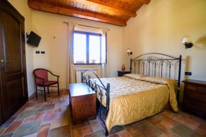 Ένα ή περισσότερα κρεβάτια σε δωμάτιο στο Agriturismo Baglio del Melograno